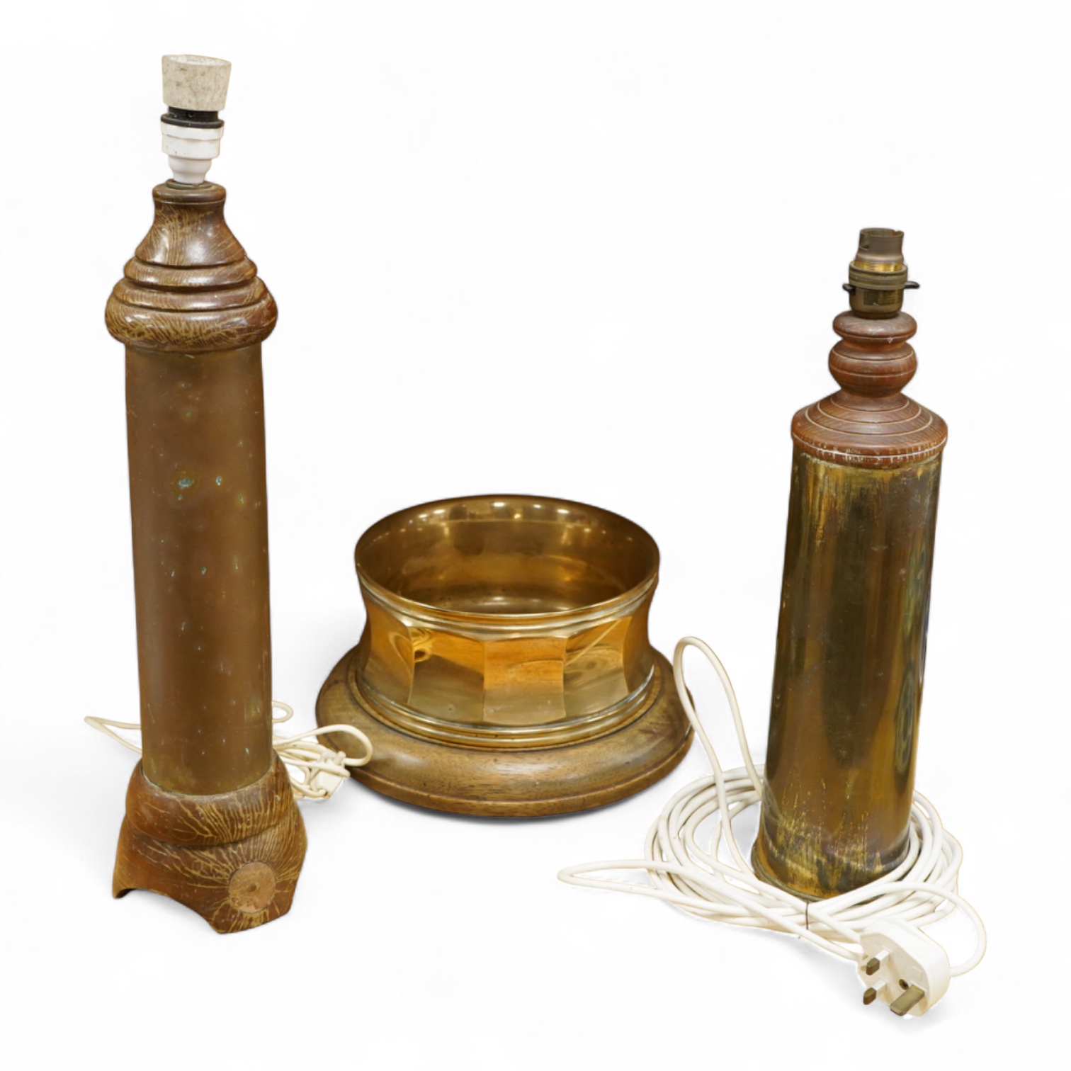 A bronze spitoon on plinth and a near pair of cartridge case table lamps, largest 46cm high
